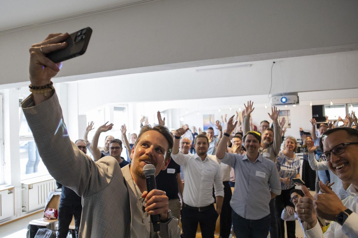 Room of Data & AI leaders cheering